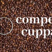 coffee beans superimposed with words "comped cuppa"